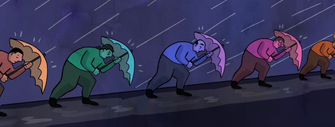 Men holding an umbrella walking uphill against the wind in a rainstorm