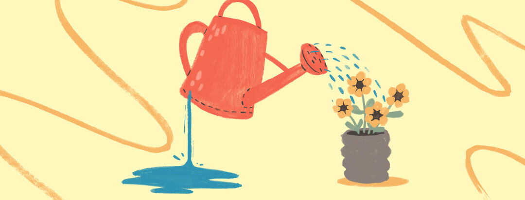 A leaking watering can waters flowers