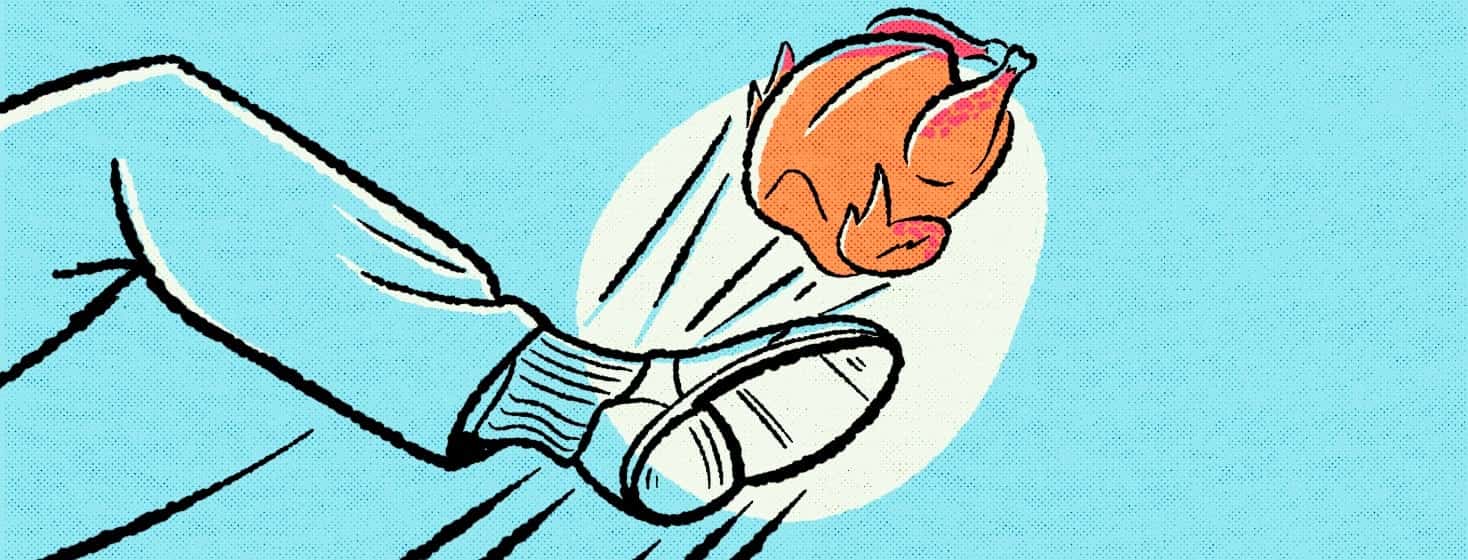 A foot punting a turkey.